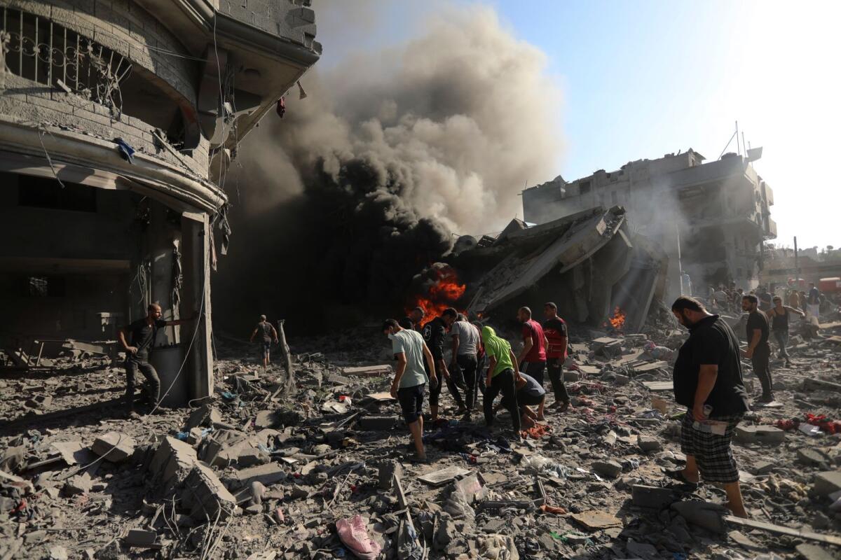 Palestinians inspect the damage of a house destroyed by an Israeli airstrike in Gaza City, Saturday, Nov. 4, 2023. Photo: AP