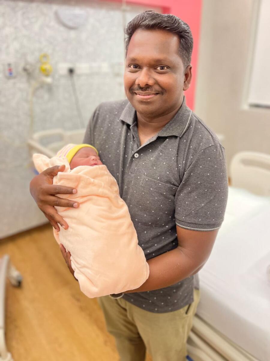 Pictured: Vineeth Kumar with baby Juan