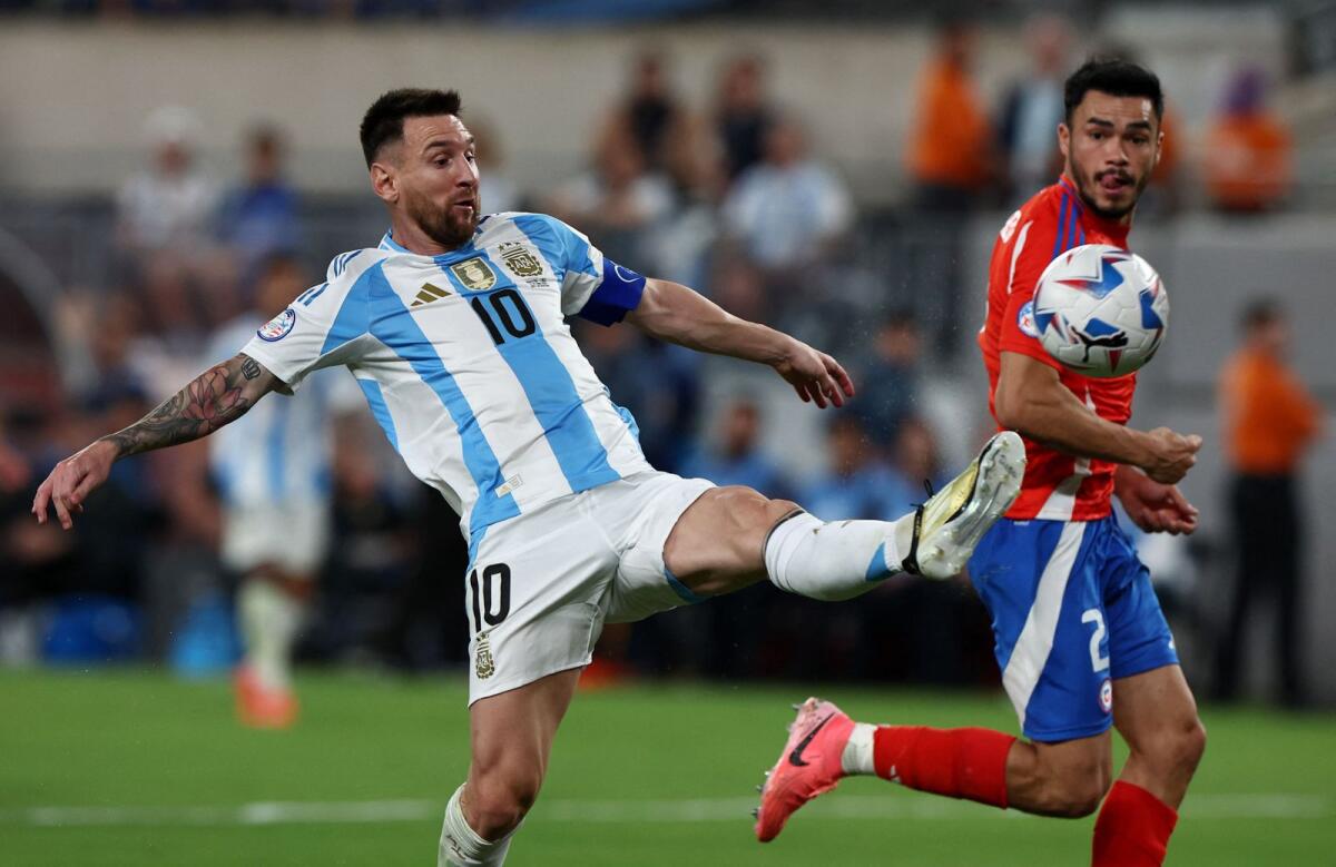 Argentina's Lionel Messi controls the ball during the match against Chile. — Reuters