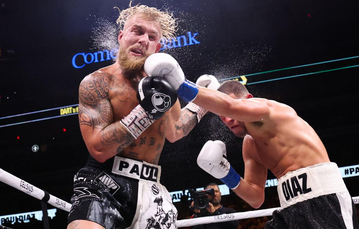 Jake Paul defeated Nate Diaz with the mthree judges scoring the fight 97-92, 98-91, and 98-91.-USA TODAY Sports