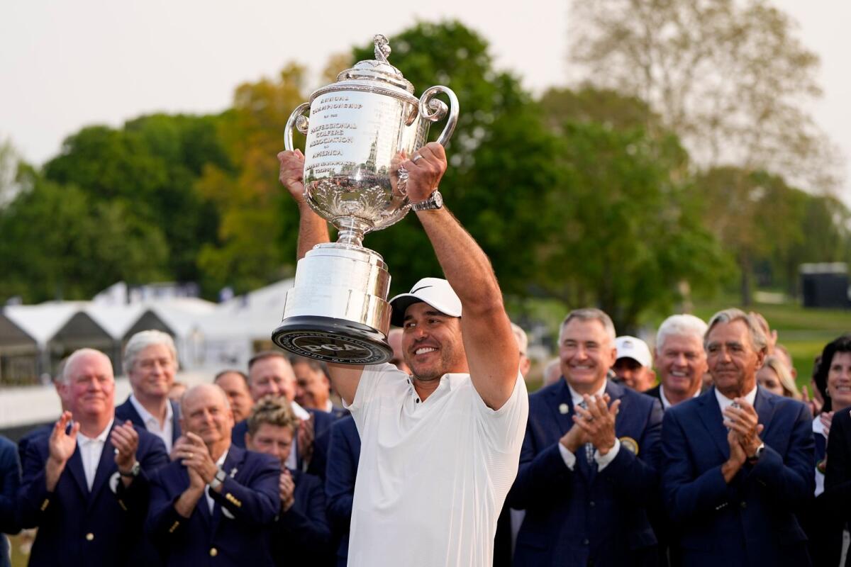 Brooks Koepka holds the Wanamaker trophy after winning the PGA Championship on May 21, 2023. — AP file