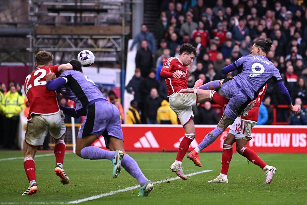 Liverpool's Uruguayan striker Darwin Nunez (No 9) scores a goal during the English Premier League football match between Nottingham Forest and Liverpool at The City Ground in Nottingham. - AFP