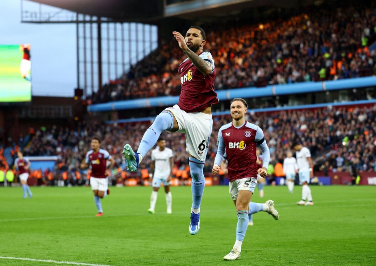 Aston Villa's Douglas Luiz celebrates a goal with Matty Cash. — Reuters