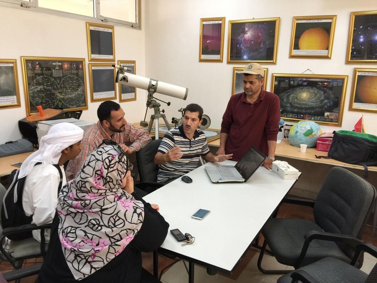 Odeh (C) holds team briefing. Photo: Astronomy Centre