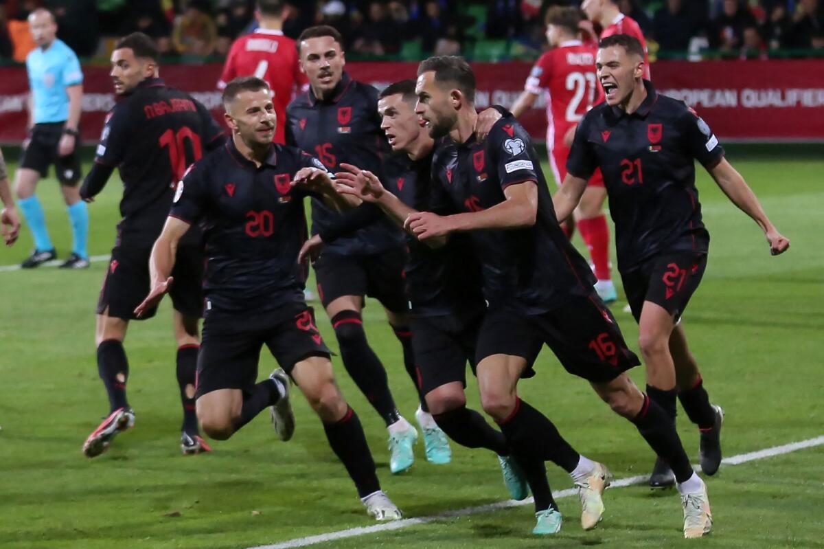 Albania's players celebrate after qualifying for the Euro 2024. — AFP file