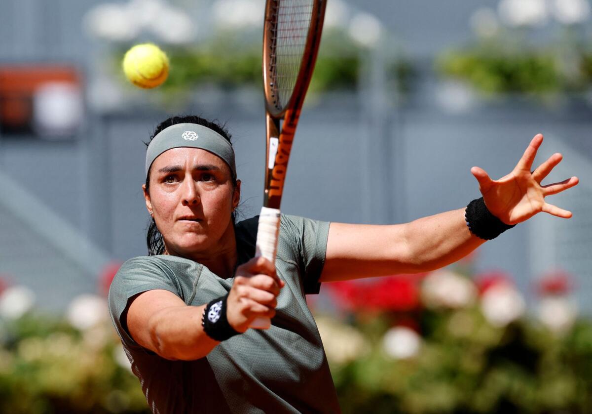 Tunisia's Ons Jabeur hits a return to Latvia's Jelena Ostapenko at the Madrid Open on Monday. — AFP