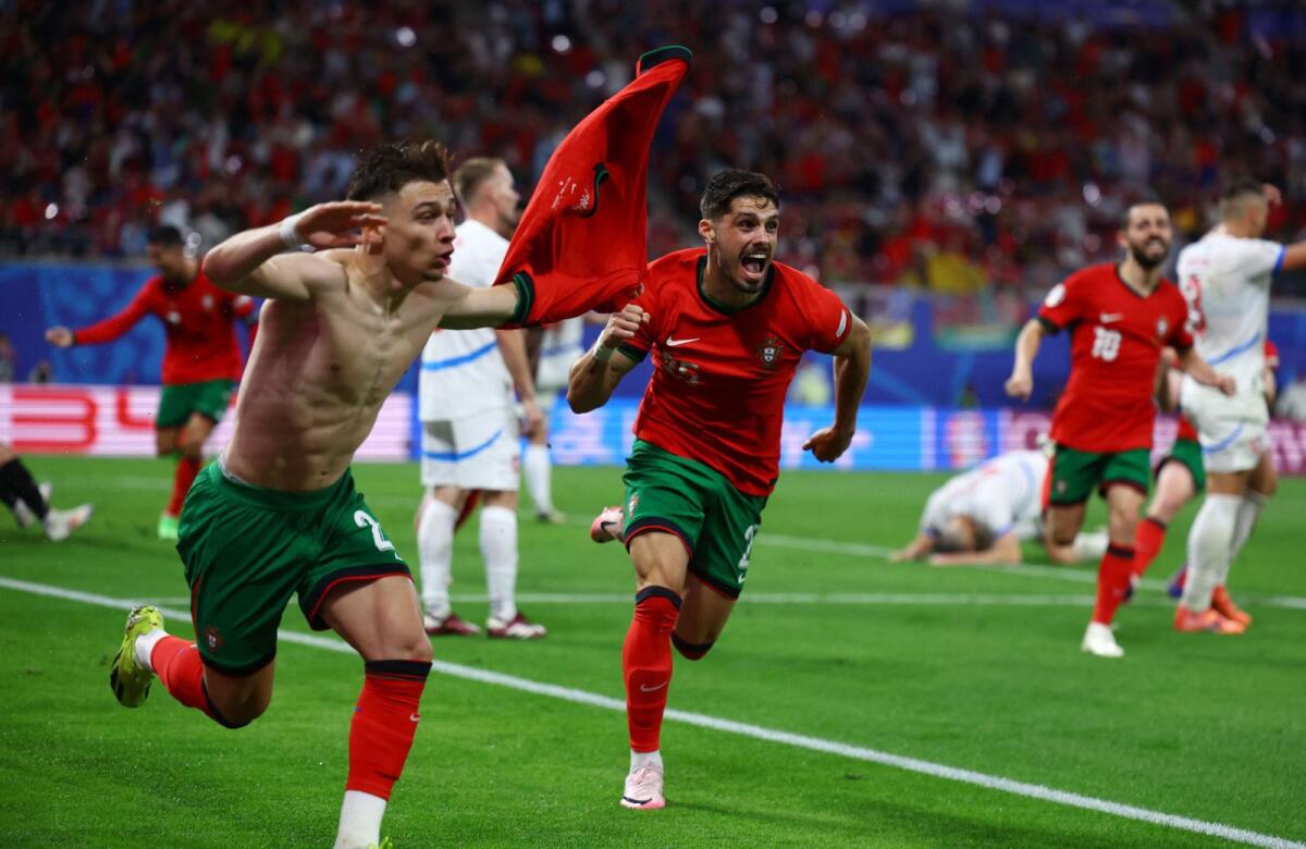 Portugal's Francisco Conceicao celebrates scoring their second goal with Pedro Neto. — Reuters