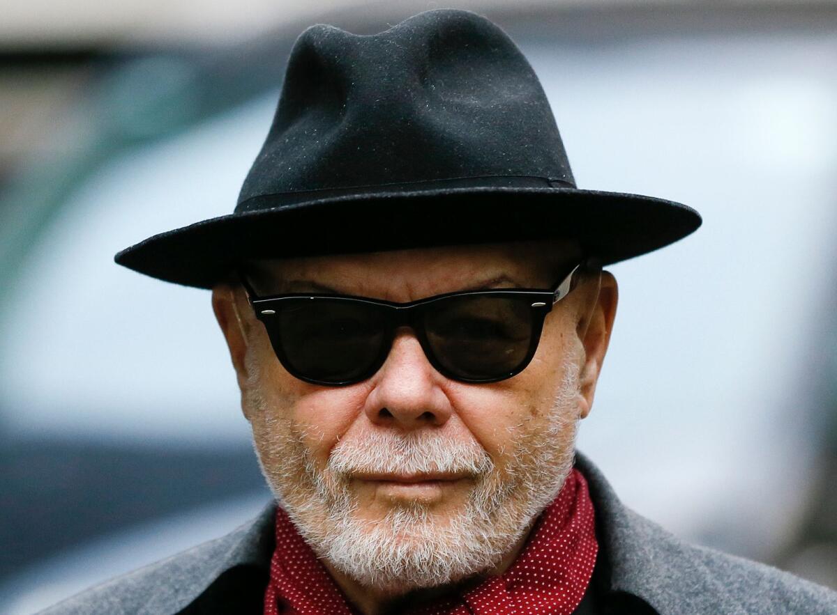 British pop star Gary Glitter, whose real name is Paul Gadd, arrives at Southwark Crown Court in London, on Feb. 4, 2015. — AP file