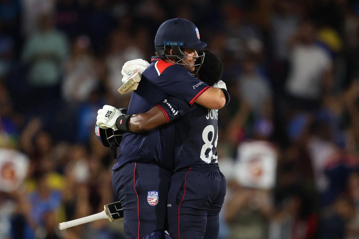 Aaron Jones of USA is embraced by teammate Corey Anderson after winning the T20 World Cup match against Canada. — AFP