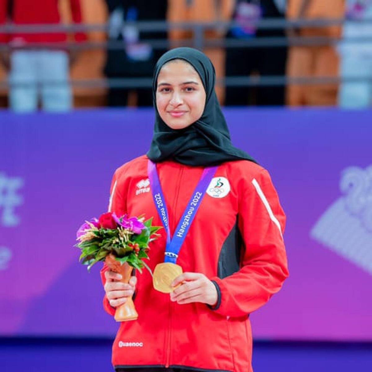 UAE's Asma Alhosani proudly displays her historic gold medal. - Supplied photo