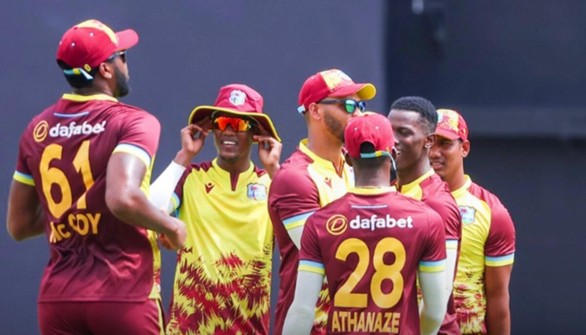 West Indies players celebrate a wicket. — X