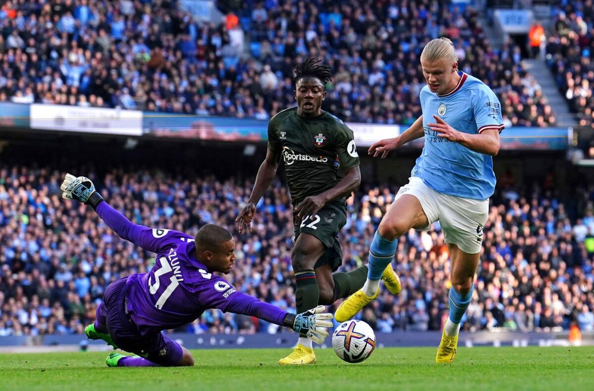 Manchester City's Erling Haaland (right) tries to get past Southampton goalkeeper Gavin Bazunu on Saturday. — AP