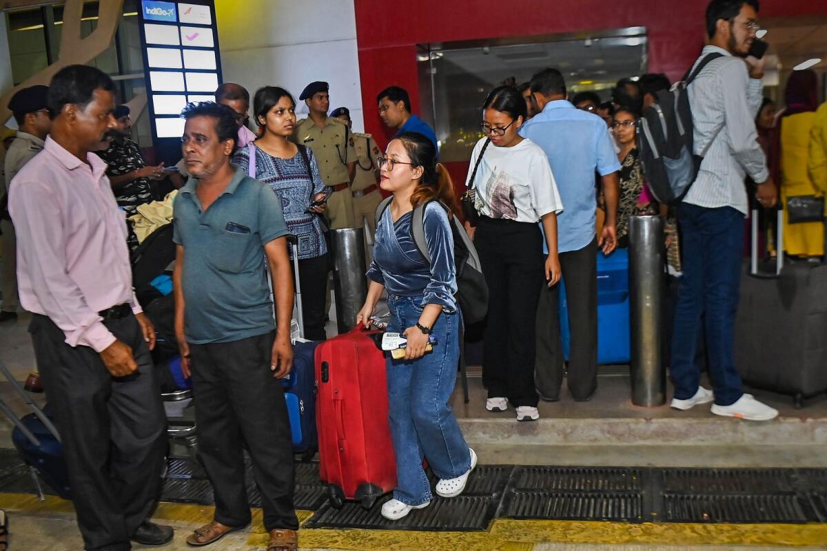 Students from Tripura, residing in Manipur, upon their arrival after being rescued from the ongoing violence in Manipur, in Agartala, early on Sunday. Photo: PTI