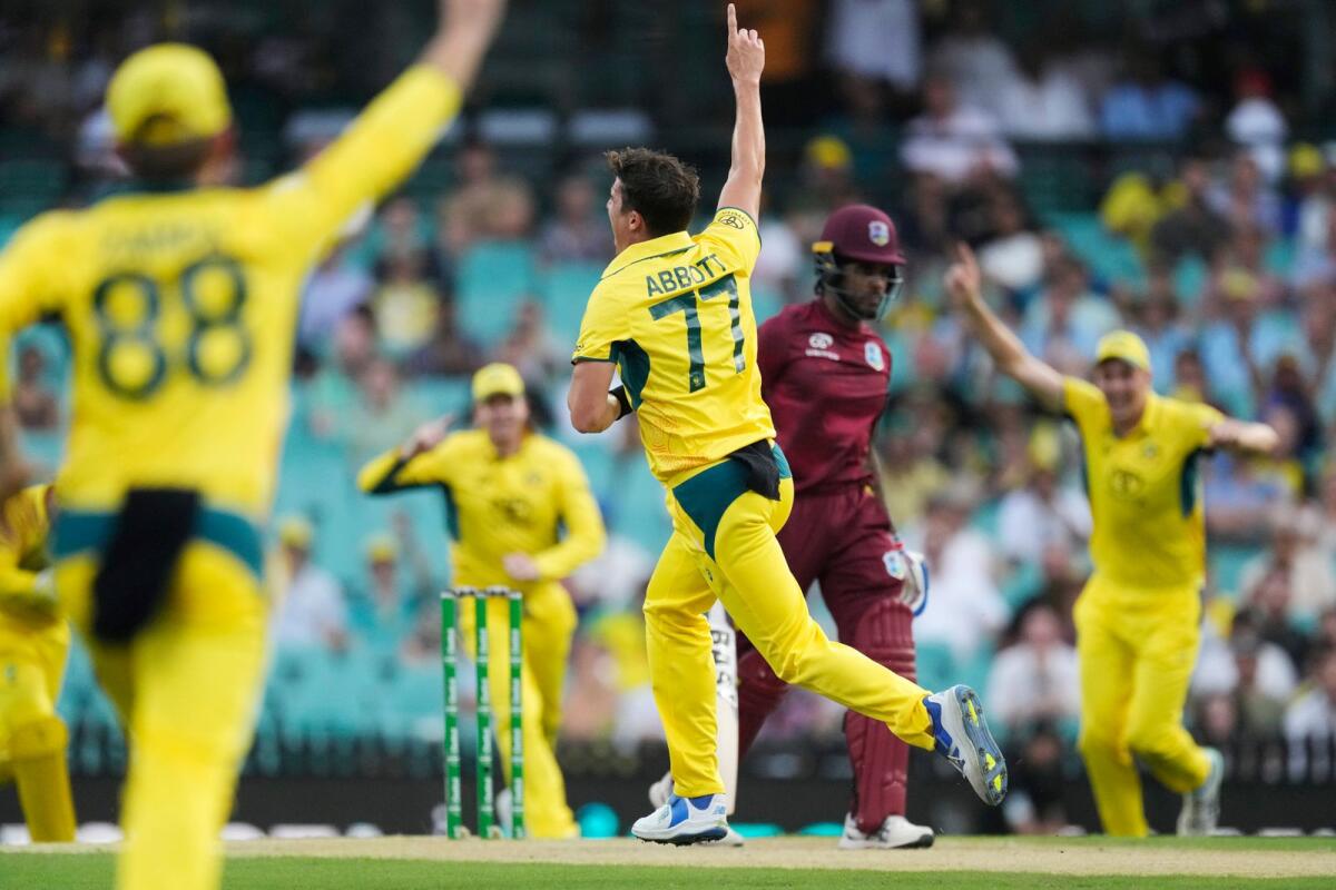 Australia's Sean Abbott (centre) celebrates taking the wicket of the West Indies' Kjorn Ottley. — AP