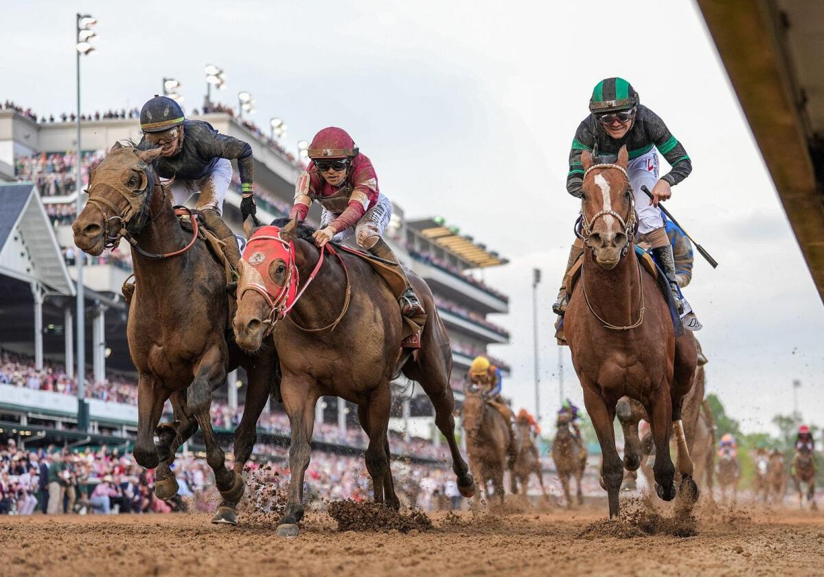 Mystik Dan (right) wins the Kentucky Derby in a photo finish at Churchill Downs. Forever Young, with Ryusei Sakai (middle) finished third and Sierra Leone (left) with Tyler Gaffalione finished second. M. - USA TODAY Sports