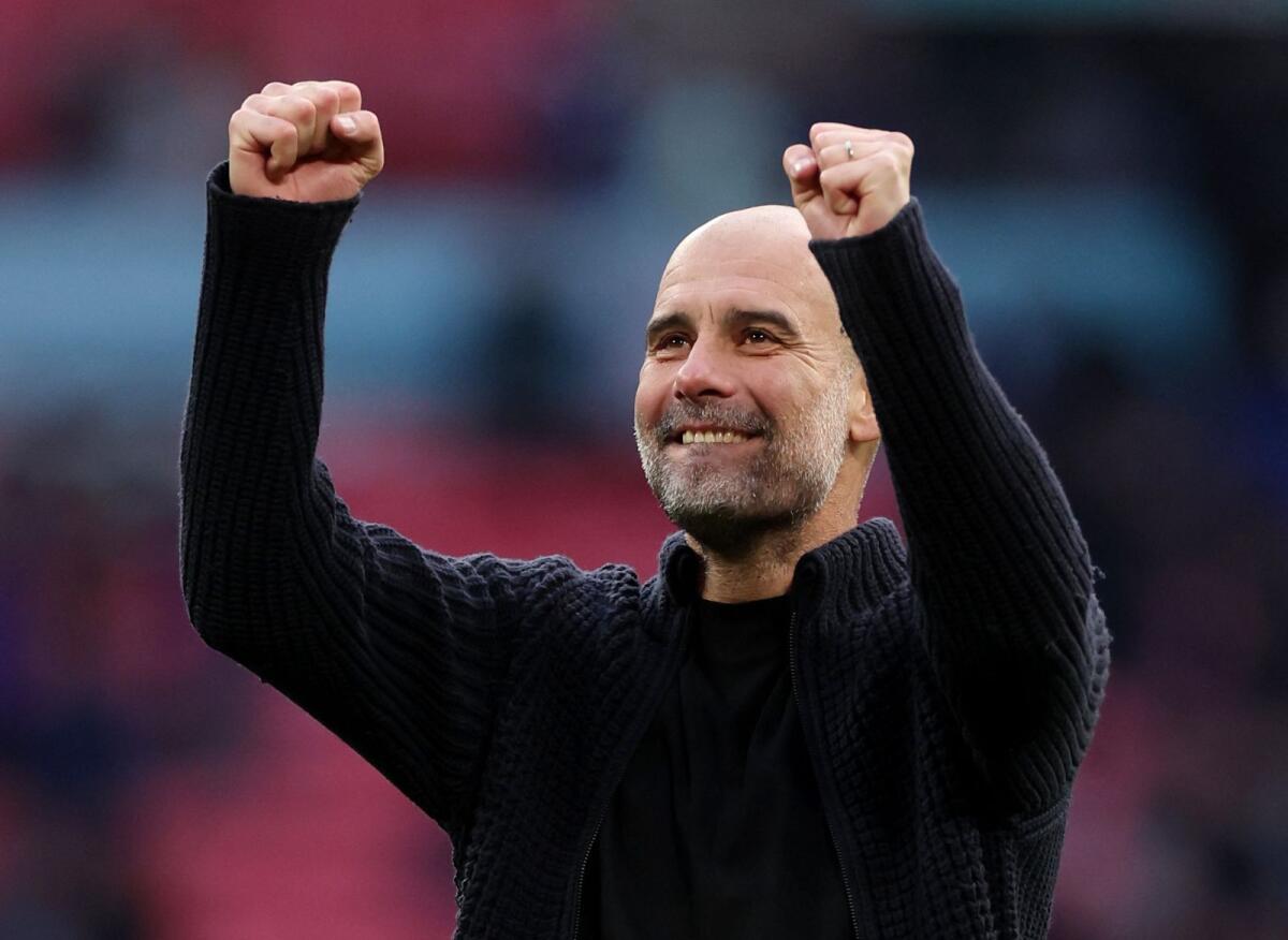 Manchester City manager Pep Guardiola celebrates after a match. - Reuters File