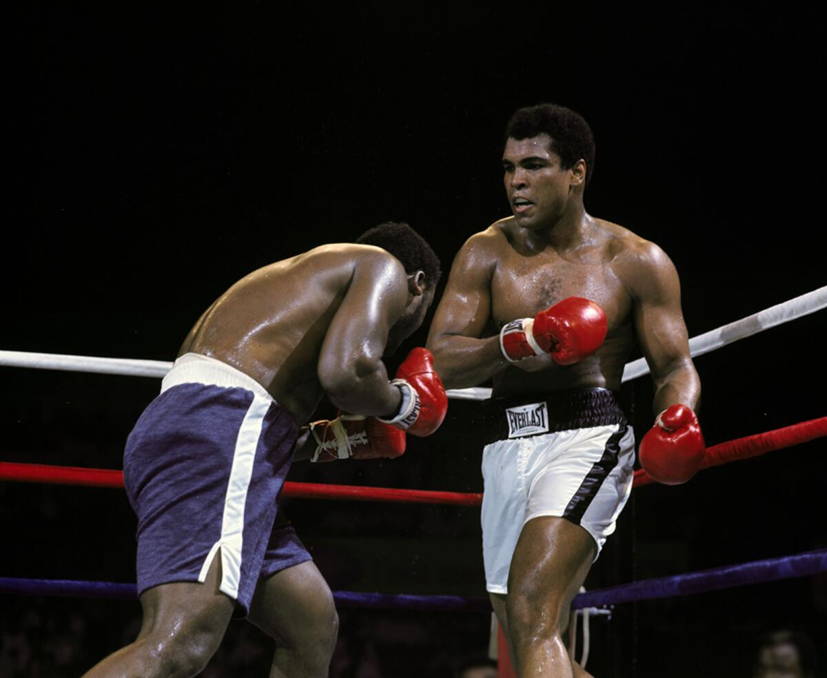Muhammad Ali and Joe Frazier during their famous battle in Manila. — X