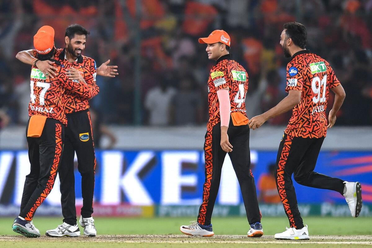 Sunrisers Hyderabad's Bhuvneshwar Kumar and his teammates celebrate after their win in the IPL match against Rajasthan Royals. — AFP