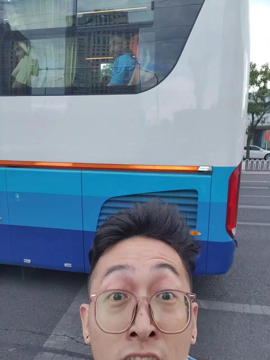 Liu Yuhang posing for a selfie as Argentine football legend Lionel Messi is seen on the team bus in Beijing. — AFP