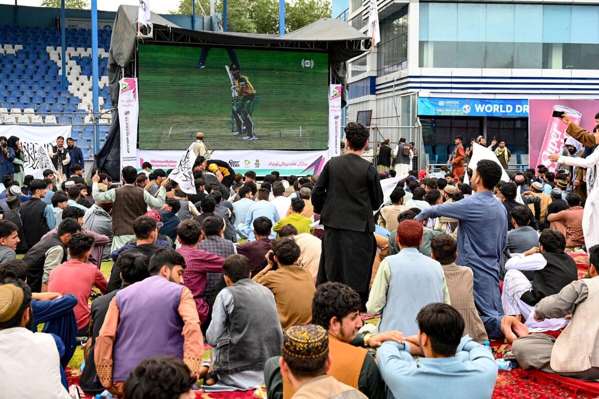 Afghan fans watch a live broadcast of the T20 semifinal between Afghanistan and South Africa on a big screen in Kabul. — AFP