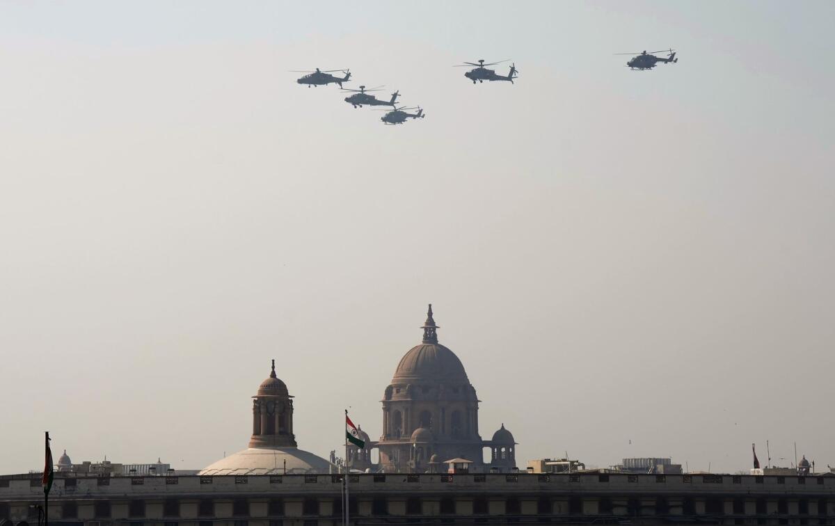 Apache helicopters fly past Parliament House during the rehearsal for the Republic Day Parade in New Delhi on January 20, 2023. PTI file