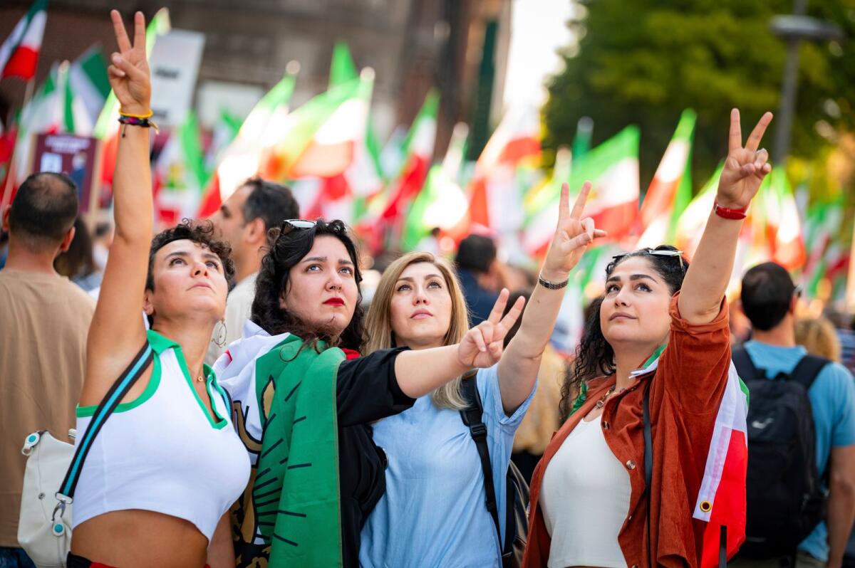 People attend a protest rally in Hamburg, Germany, on Sept. 16, 2023 to mark the first anniversary of the death of Mahsa Amini in the custody of Iran’s morality police last year. — AP file