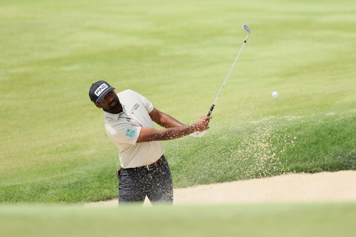Sahith Theegala of the United States plays a shot from a bunker on the 18th hole during the first round of the 2024 PGA Championship.  - AFP