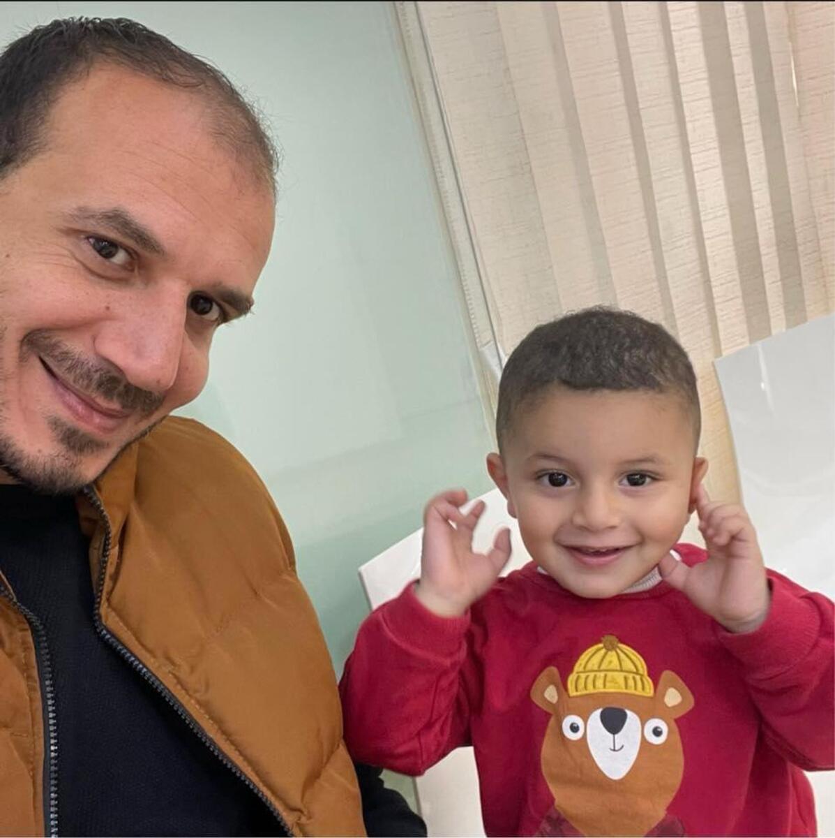 Ahmed with his son