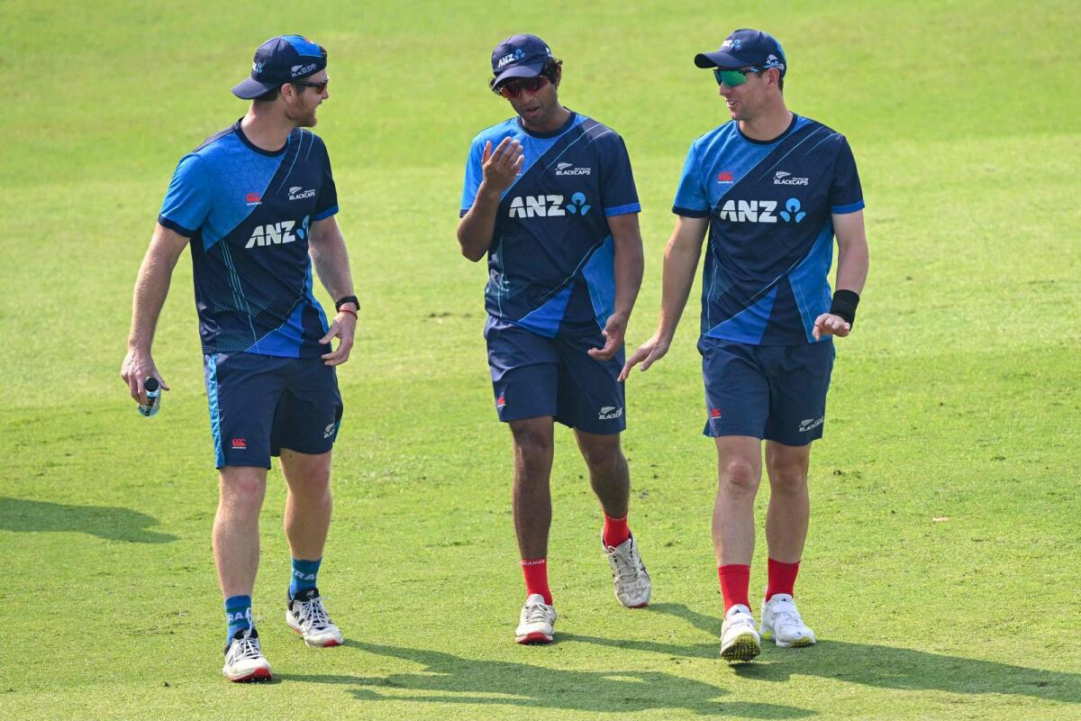 New Zealand's Glenn Phillips, Rachin Ravindra and Matt Henry attend a practice session  in Pune. — AFP