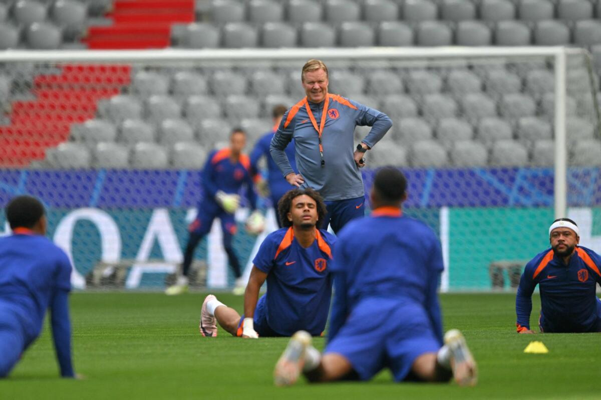 Netherlands' head coach Ronald Koeman (centre) during a team training session on Sunday. — AFP