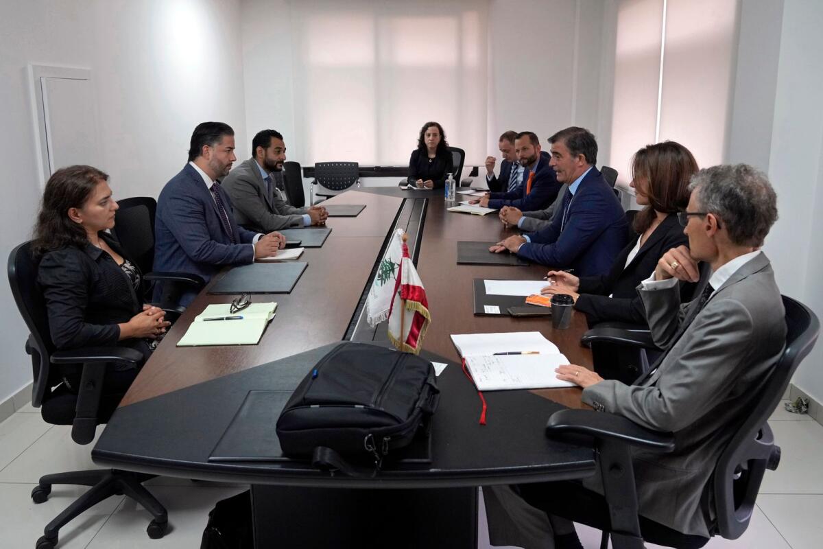 Lebanese caretaker Minister of Economy and Trade Amin Salam, second left, meets with a delegation from the International Monetary Fund in Beirut, Lebanon, on Tuesday, Sept. 20, 2022. -- AP