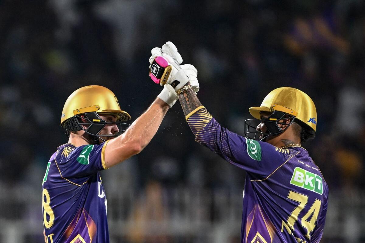 Kolkata Knight Riders' Phil Salt (left) is congratulated by Sunil Narine after scoring a half-century. — AFP