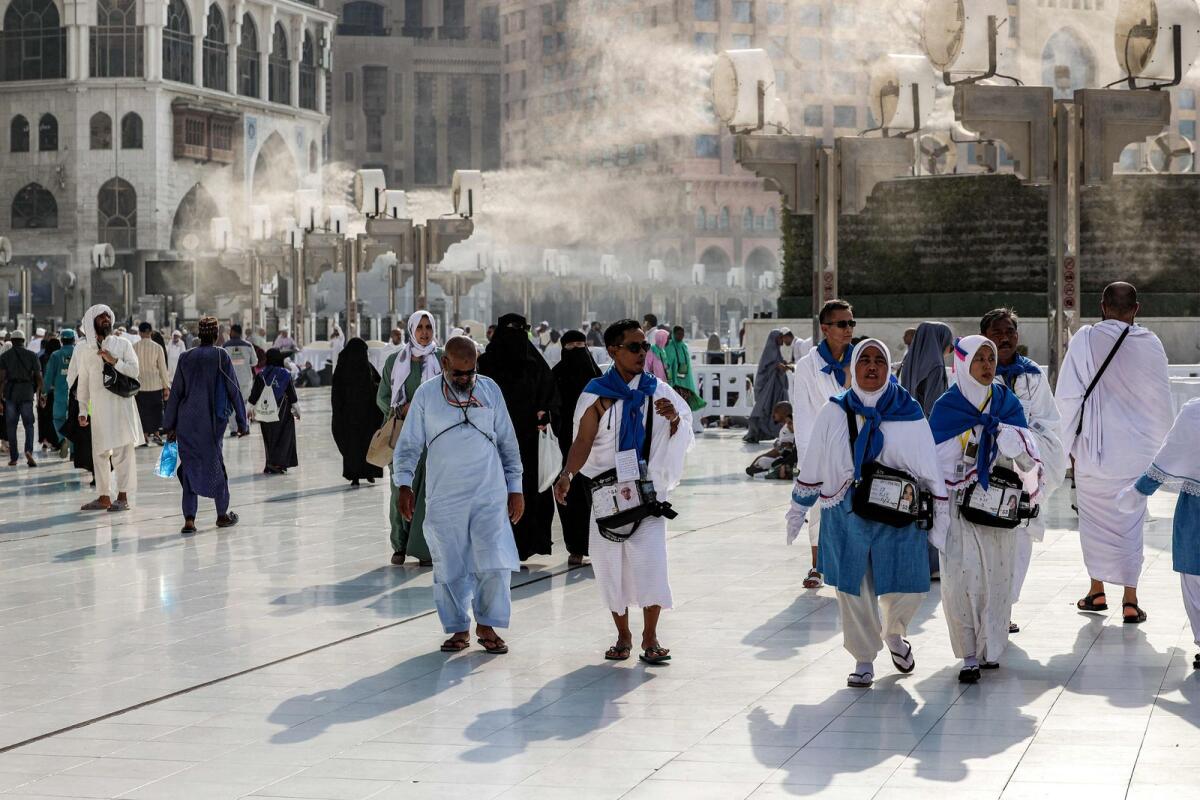 Fans blow air mixed with water vapour to cool off Muslim pilgrims walking at the Grand Mosque in Saudi Arabia's holy city of Makkah on June 4, 2024 ahead of the annual Haj pilgrimage.   — AFP