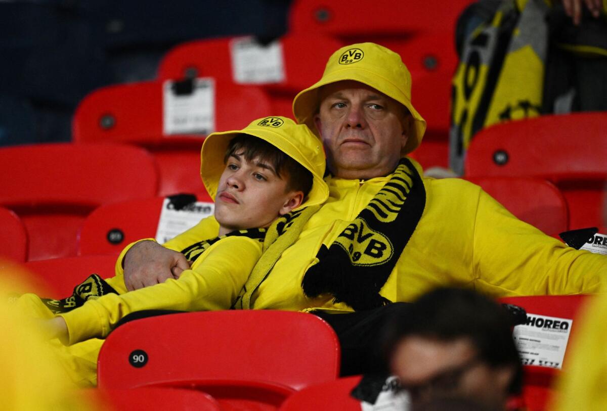 Borussia Dortmund fans look dejected after the match. — Reuters
