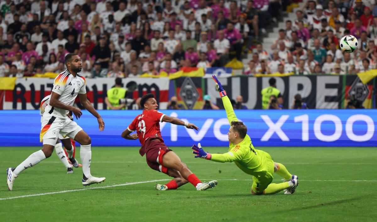 Switzerland's Dan Ndoye scores a goal against Germany. — Reuters