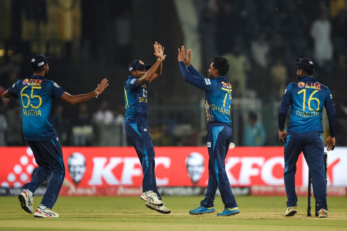 Sri Lanka players celebrate after winning the Asia Cup match against Afghanistan. — AFP