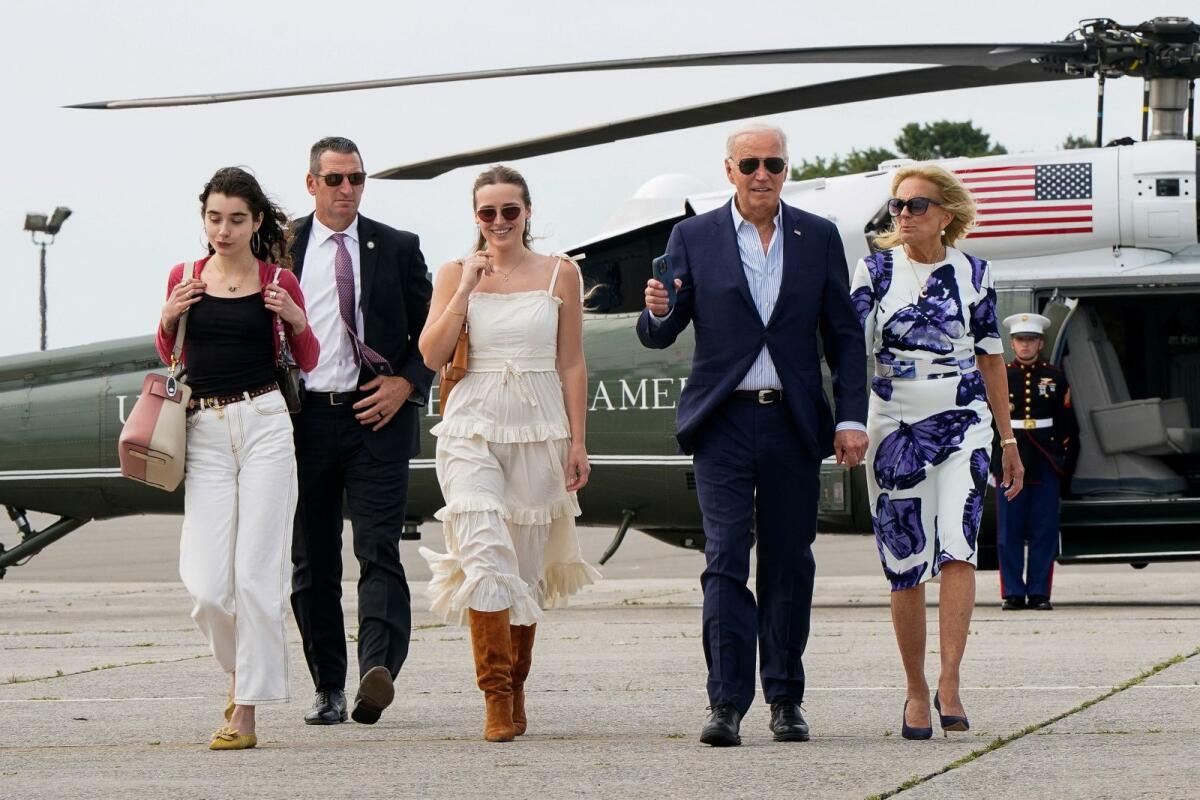 US President Joe Biden, first lady Jill Biden, and granddaughters Finnegan and Natalie Biden walk from Marine One to Air Force One at Francis S. Gabreski Airport in Westhampton Beach, New York, US, on Saturday. — Reuters