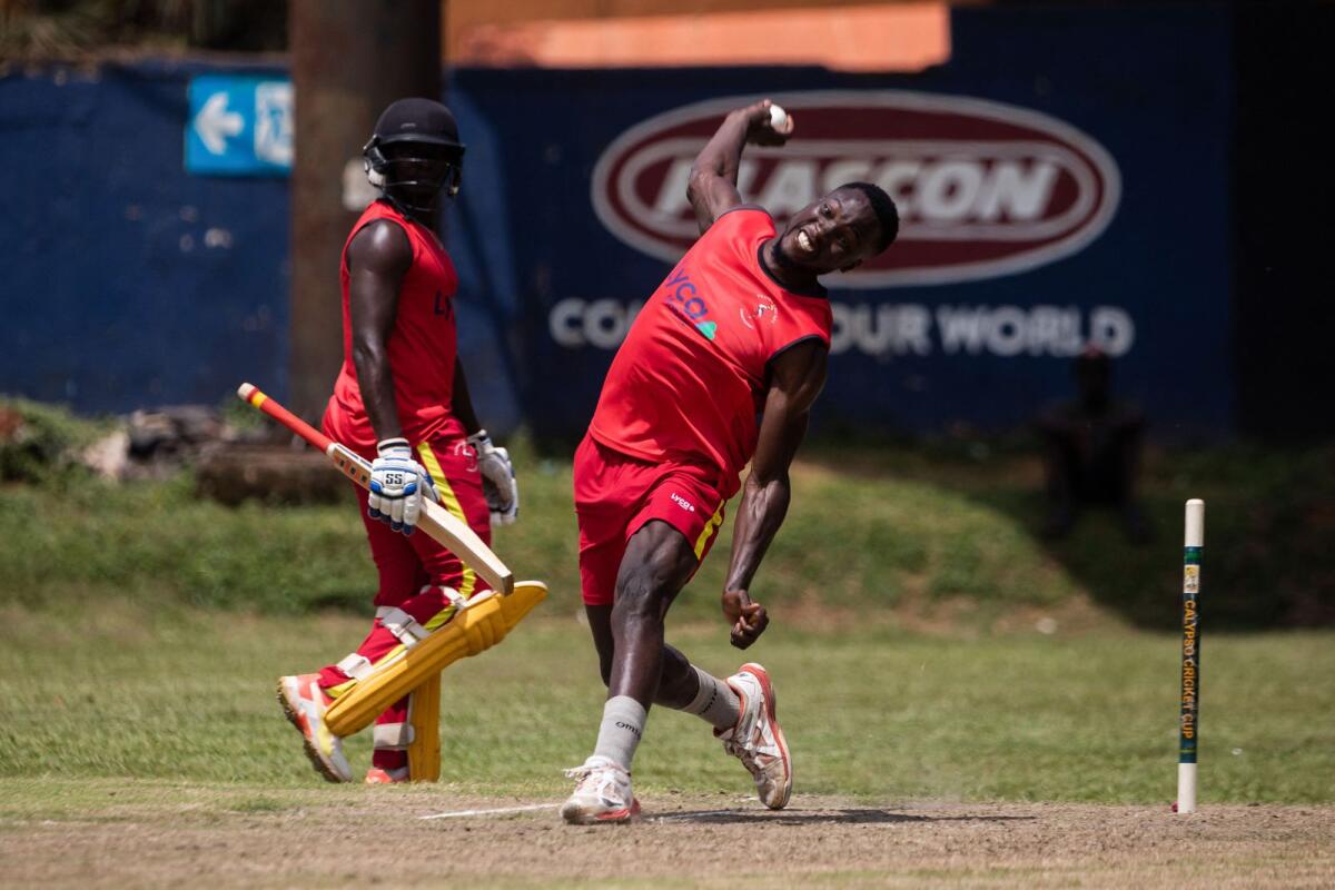 Uganda's Siraje Nsubuga bowls during a practice session at the Lugogo Cricket Oval in Kampala on May 17. — AFP