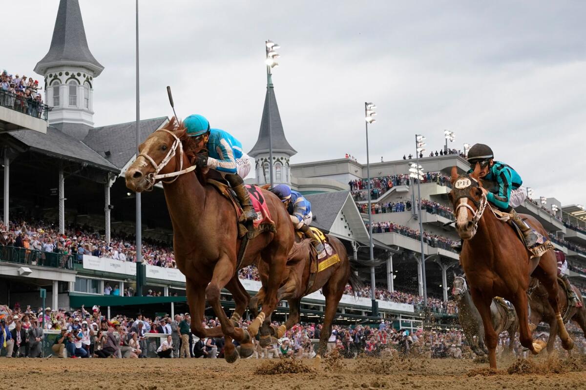 Mage (8), with Javier Castellano aboard, wins the 149th running of the Kentucky Derby. - AP File