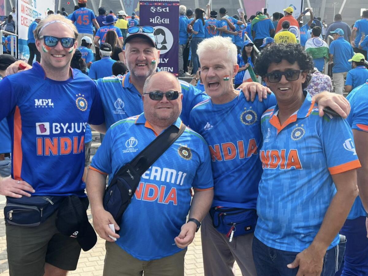 Gopal Jasapara (right) with England fans who were supporting India in the final. — Supplied photo