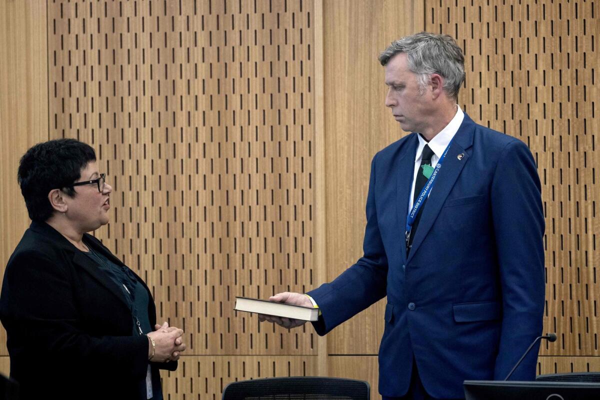 Detective Senior Sergeant Craig Farrant (R) attends the opening of a coronial inquiry into the 2019 Christchurch massacre, in Christchurch on Tuesday.. – AFP