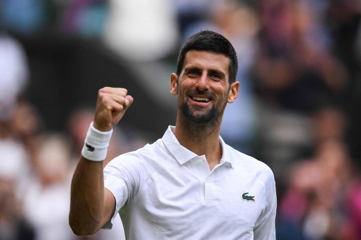 Serbia's Novak Djokovic celebrates winning against Russia's Andrey Rublev. — AFP
