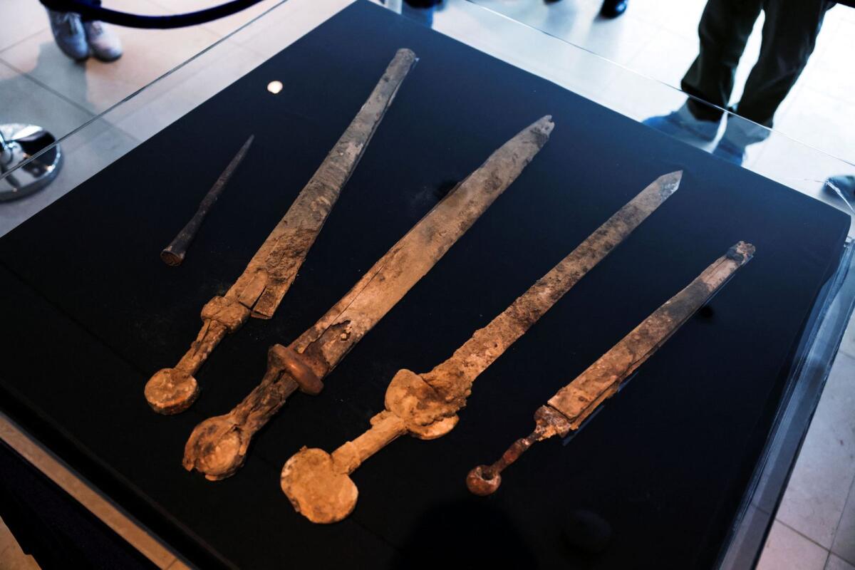 Ancient swords, believed by the Israel Antiquities Authority to be from the Roman era dating back 1,900 years and found in a weapons cache in a cave in an Israeli desert, are displayed in Jerusalem on Tuesday. — Reuters