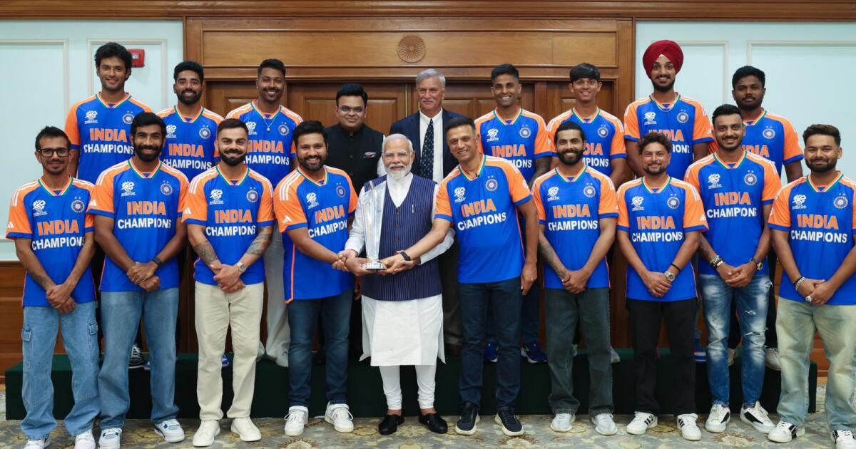 Prime Minister Narendra Modi with members of the World Cup-winning Indian team. — X