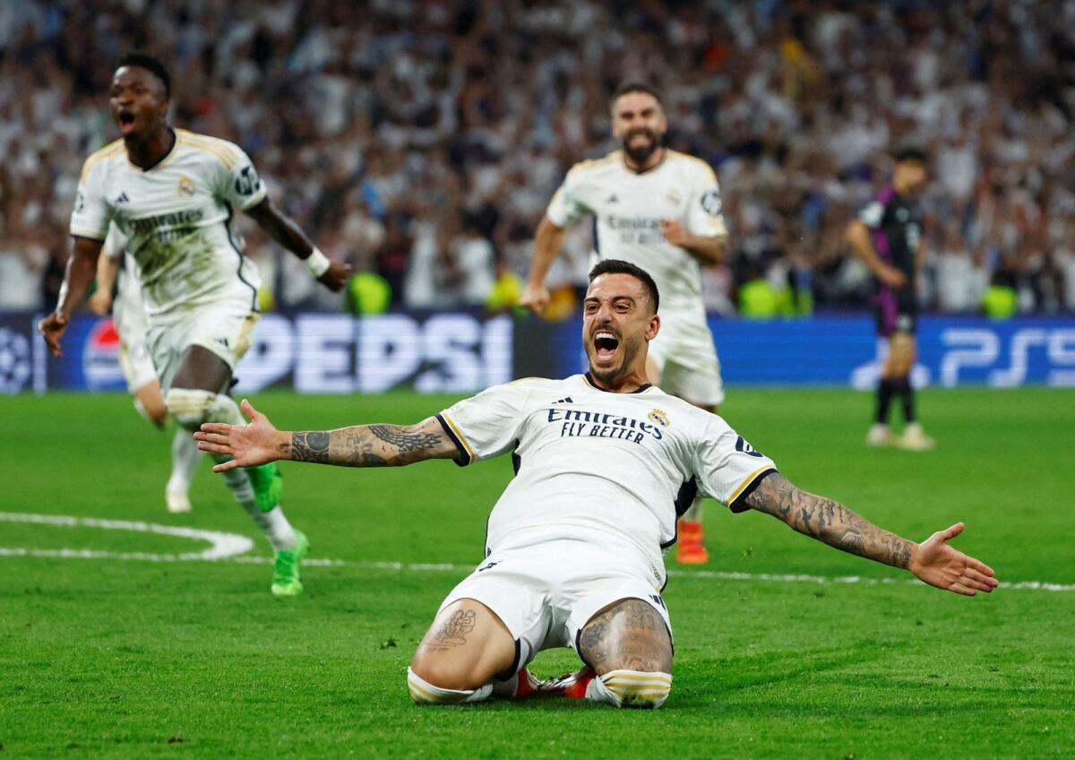 Real Madrid's Joselu celebrates after scoring their second goal. — Reuters