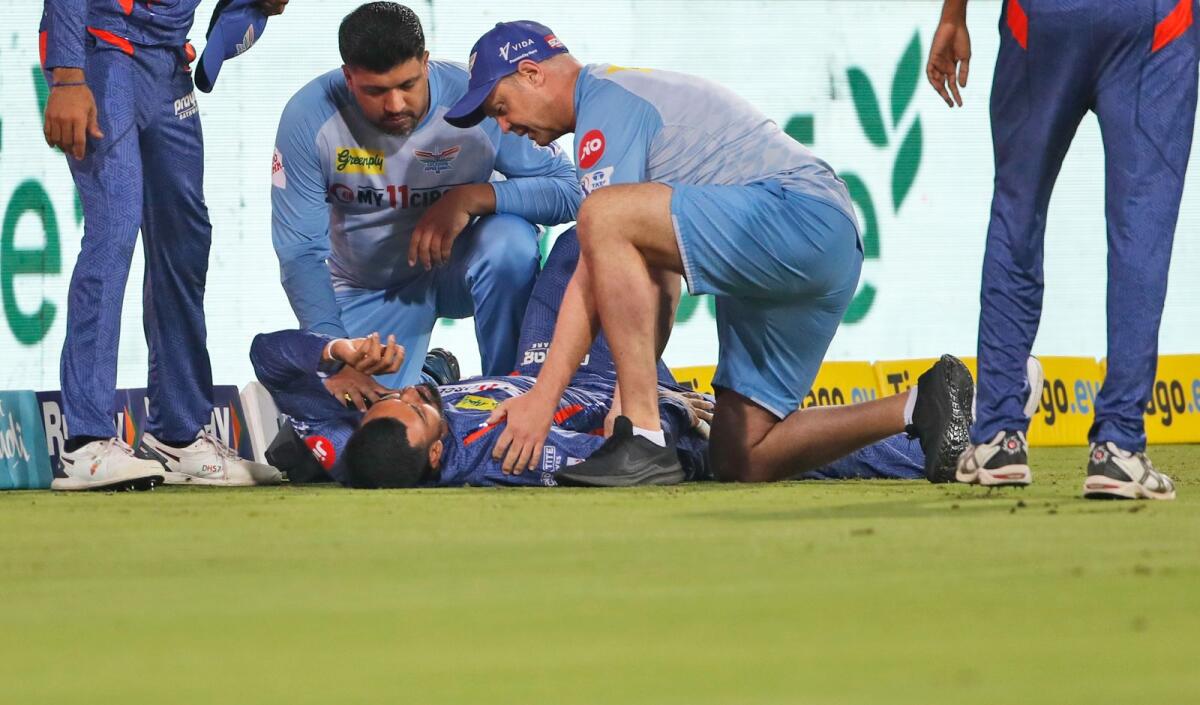 Medical staff examines Lucknow Super Giants' captain KL Rahul during the game against Royal Challenger Bangalore. — AP