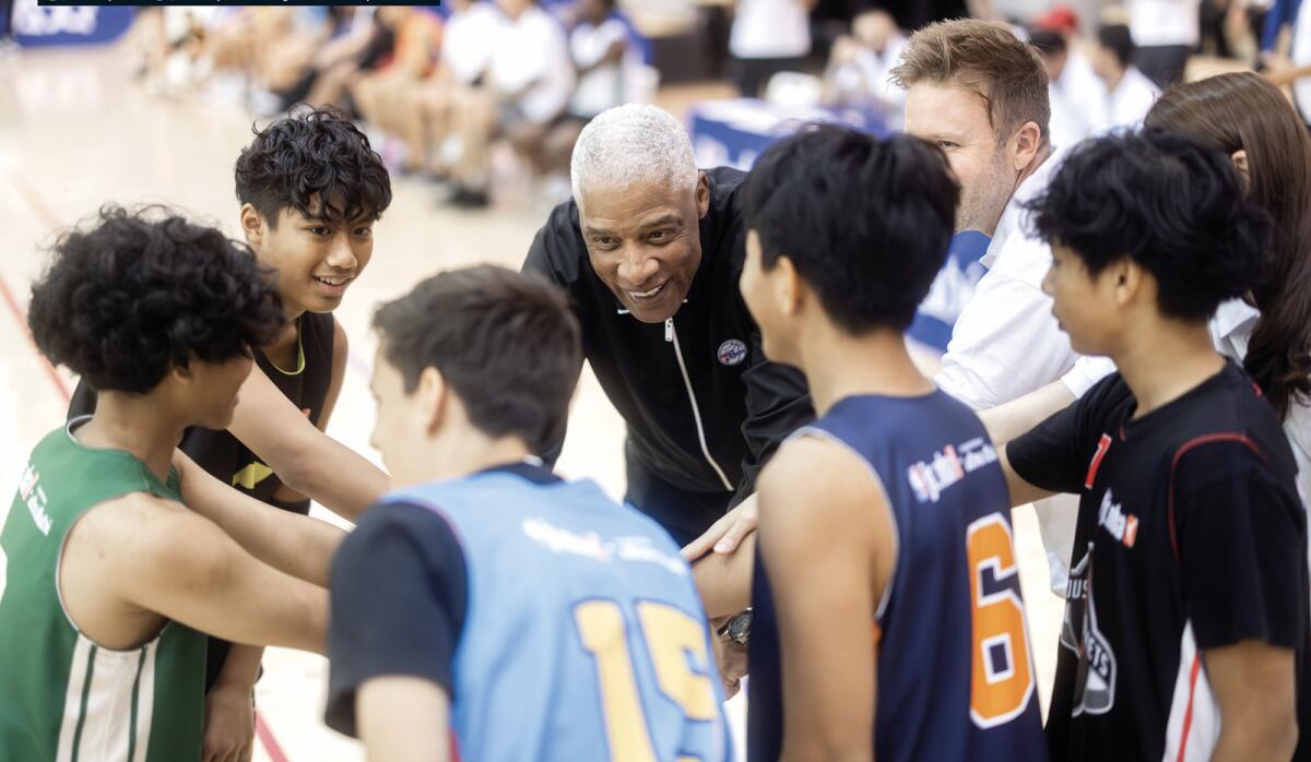 Julius Erving with aspiring basketball players in Abu Dhabi. — Supplied photo
