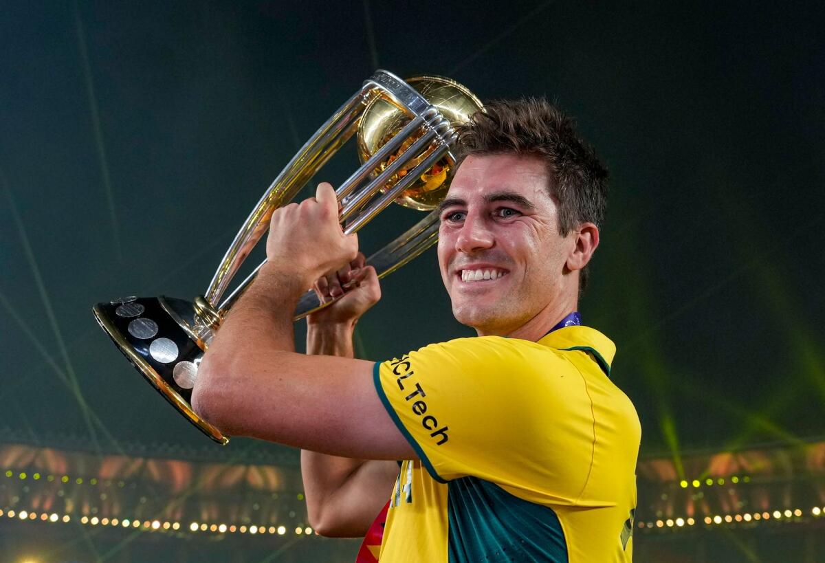 Australian captain Pat Cummins holds the trophy after winning the World Cup final. — PTI