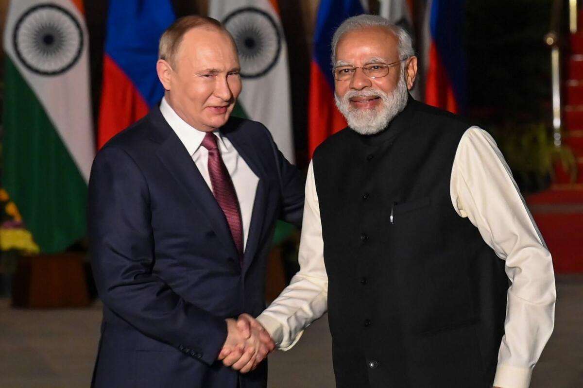 Indian Prime Minister Narendra Modi (R) greets Russian President Vladimir Putin before a meeting at Hyderabad House in New Delhi on December 6, 2021. AFP FILE