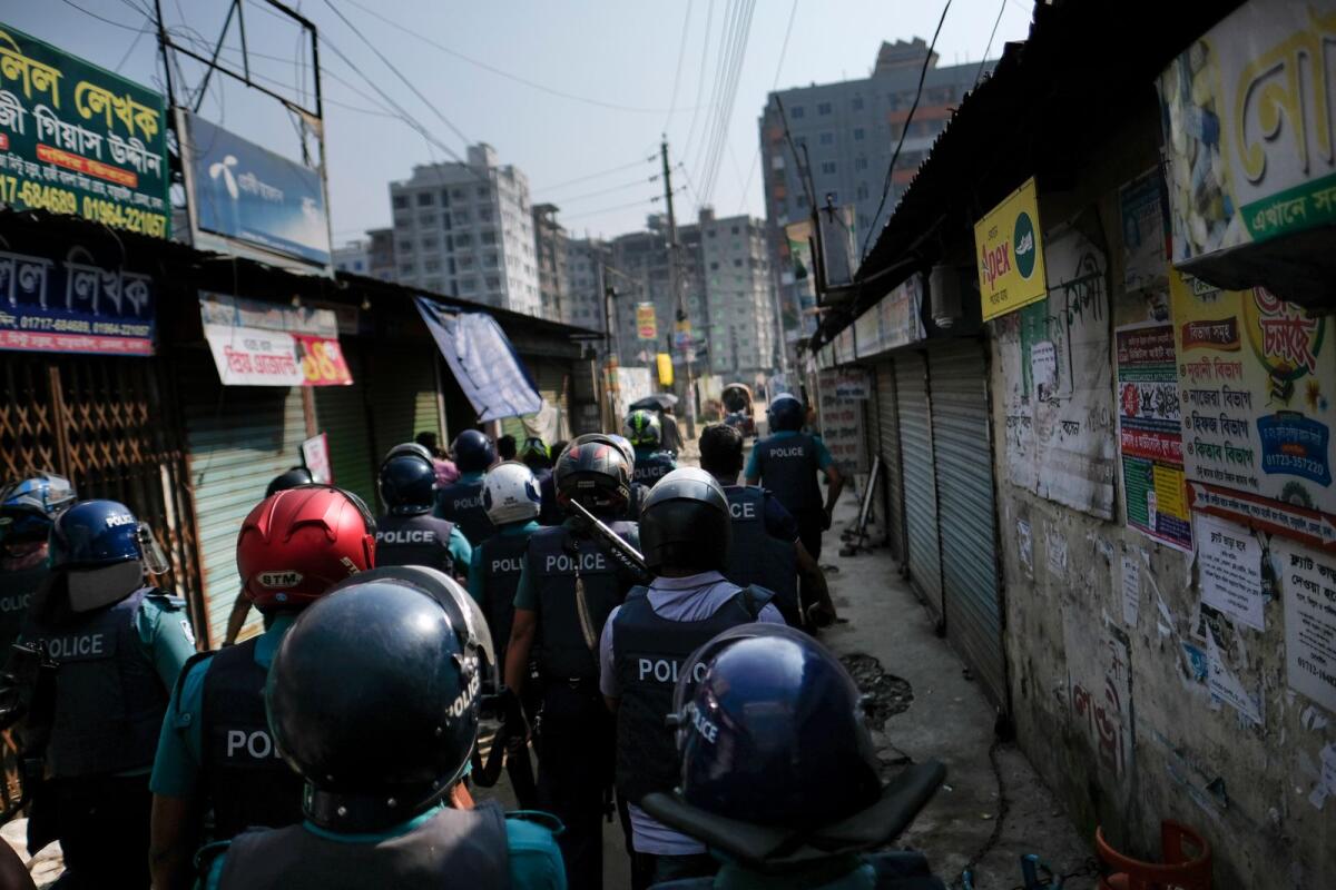Police look for activists of main opposition Bangladesh Nationalist Party (BNP) who were trying to enforce a three-day blockade in Dhaka, Bangladesh, on Tuesday. – AP